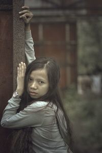 Portrait of girl standing outdoors