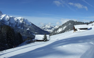 Scenic view of snowcapped mountains against sky