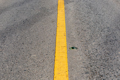 High angle view of yellow line on road