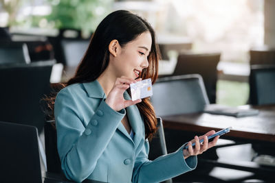 Young woman using mobile phone