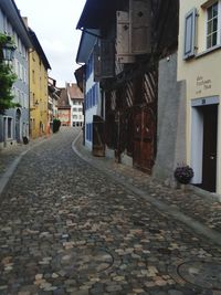 Footpath amidst buildings in town