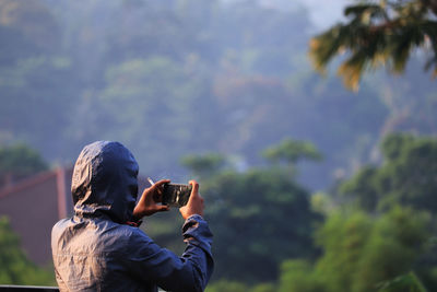 Portrait of man photographing