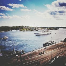 View of harbor against cloudy sky