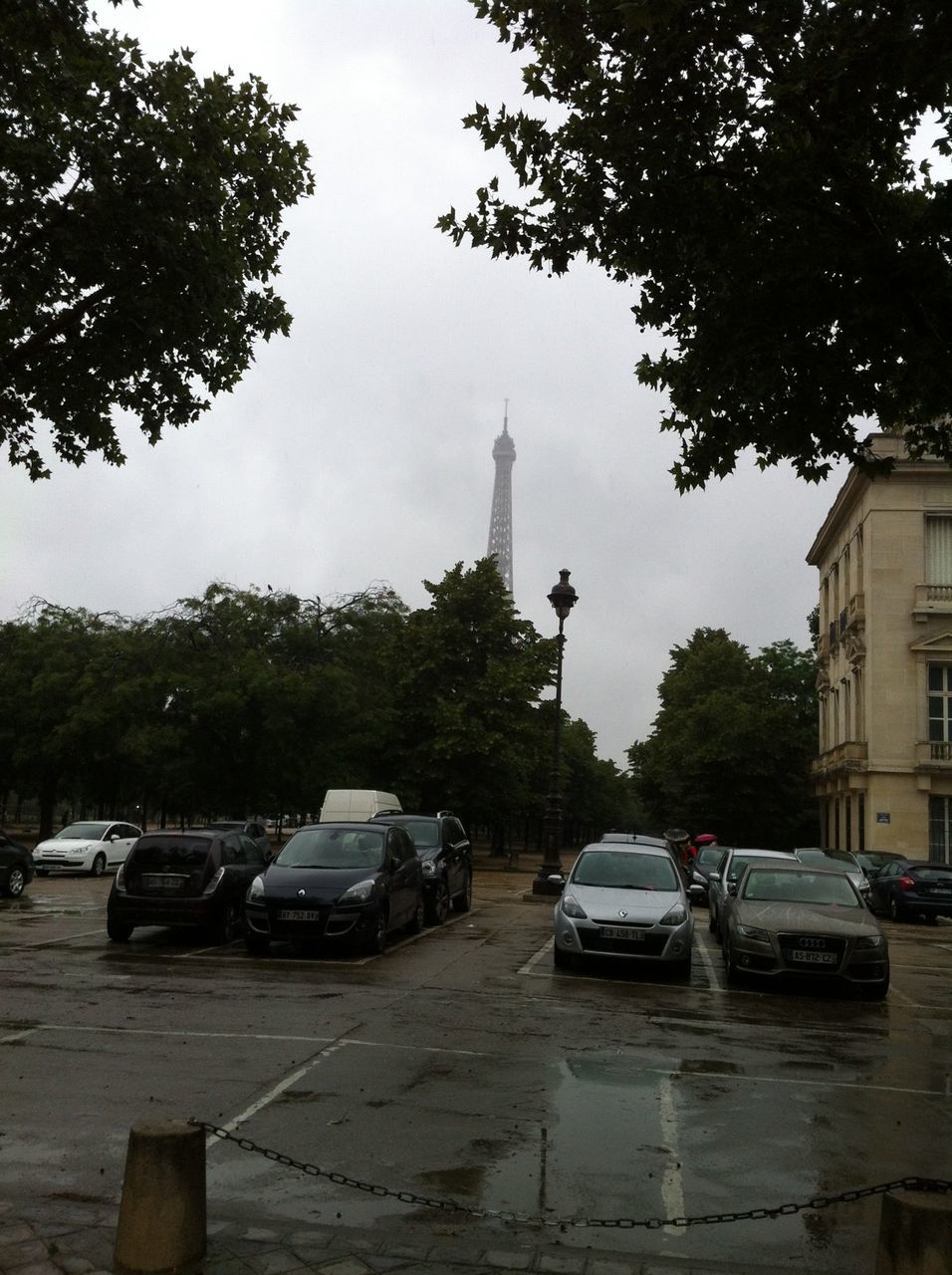 CARS ON CITY STREET AGAINST SKY IN BACKGROUND