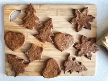 High angle view of cookies on cutting board