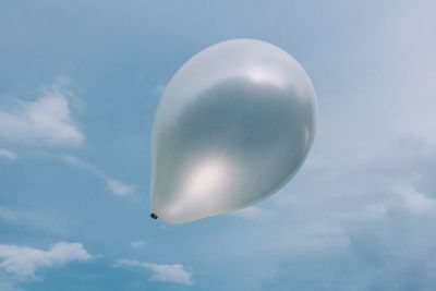 Low angle view of airplane flying in sky