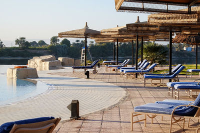 Luxury hotel pool. umbrellas and chairs.