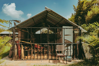 House by building against sky