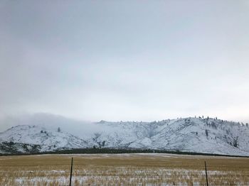 Scenic view of snow field against sky