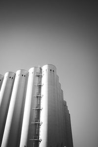 Low angle view of factory against clear sky