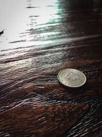 Close-up of coin on table