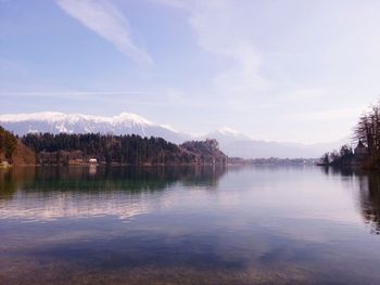 Scenic view of lake with mountains in background