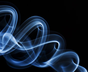 Close-up of smoke against black background