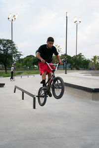 Man riding bicycle on street