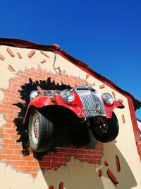 Low angle view of red structure against clear sky