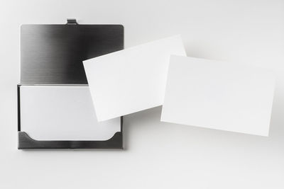 Low angle view of paper board against white background