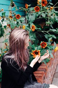 Woman by flowering plants