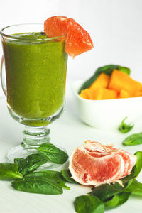 Close-up of orange juice on table