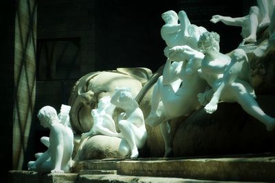 Low angle view of statue against historic building