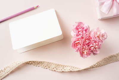 High angle view of pink flower on table