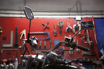 Bikers world, bikers garage, repair tools on a red wall and motorcycle , repairing workshop 