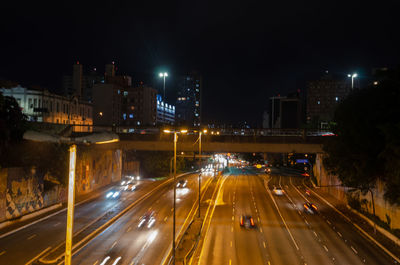 High angle view of light trails on road at night