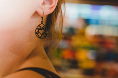 Close-up of woman wearing earring