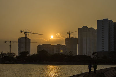 Silhouette of city at sunset