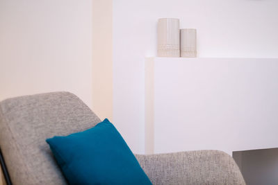 Close-up of sofa against wall at home