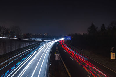 High angle view of light trails on road in city