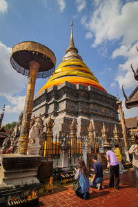 Group of people in temple against building