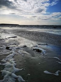 Scenic view of sea against sky during winter