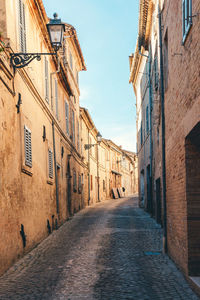 Narrow alley amidst buildings in town