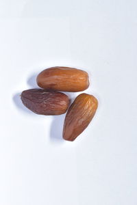 High angle view of bread against white background