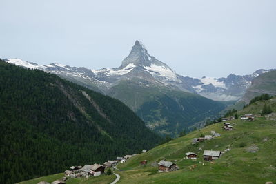 Scenic view of snowcapped mountains against clear sky