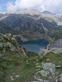 Scenic view of lake and mountains against sky