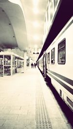 Train at railroad station against sky