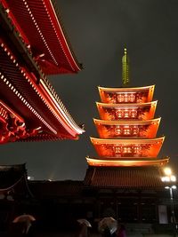 Low angle view of pagoda at night
