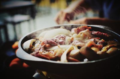 Close-up of meat in cooking pan