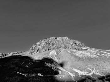 Black and white mountain against the sky