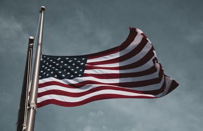 Low angle view of flag against sky