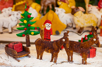 Close-up of christmas figurines on table