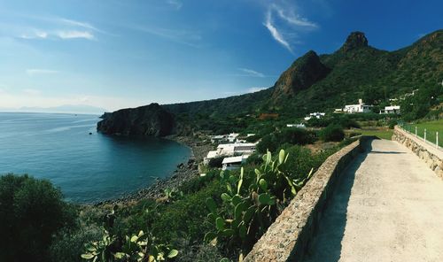 Panoramic view of sea and mountains against sky