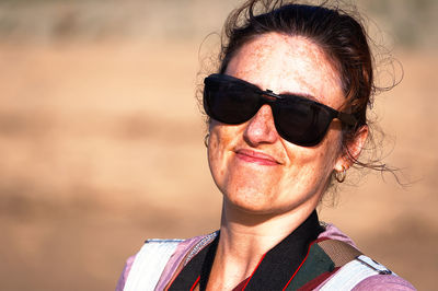 Portrait of young woman wearing sunglasses