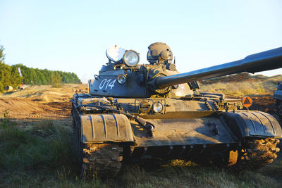 Low angle view of abandoned vehicle against clear sky