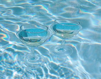 Close-up of wineglasses in water