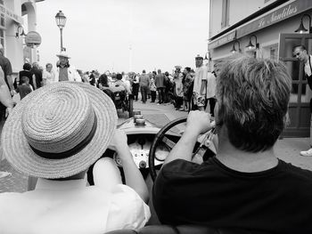 Woman sitting in city