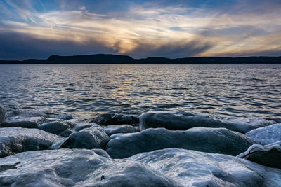 Scenic view of sea against cloudy sky