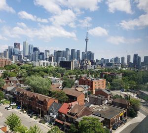 High angle view of modern buildings in city against sky