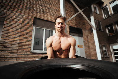 Mature man exercising in backyard